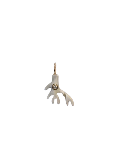 Silver Coral charm with clear stones on a white background