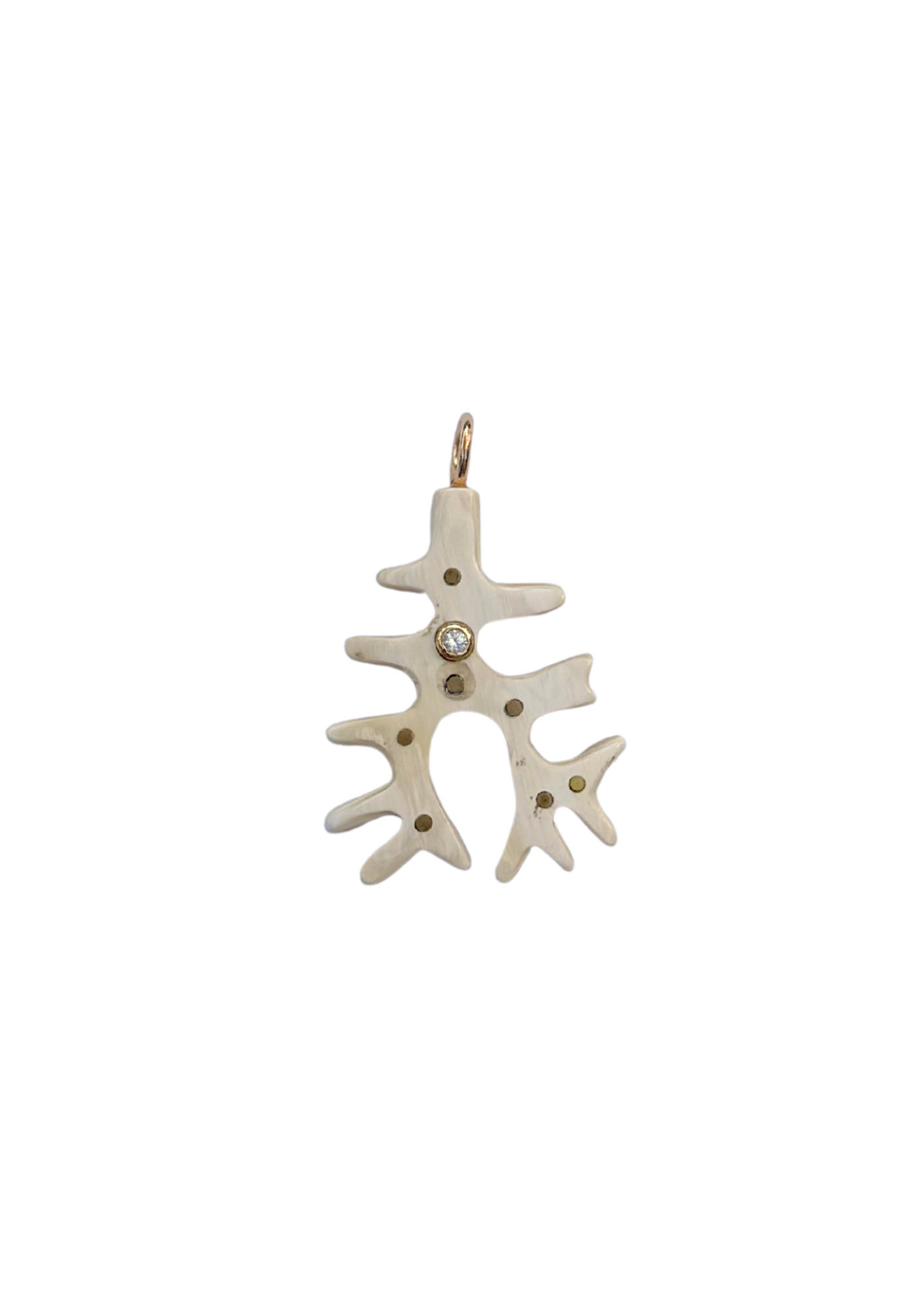 White coral-shaped pendant with a small gemstone on a white background