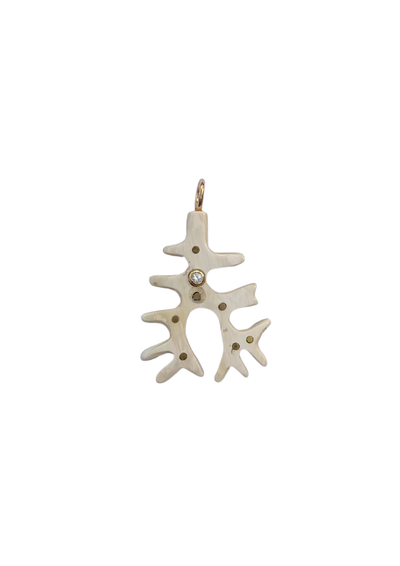 White coral-shaped pendant with a small gemstone on a white background