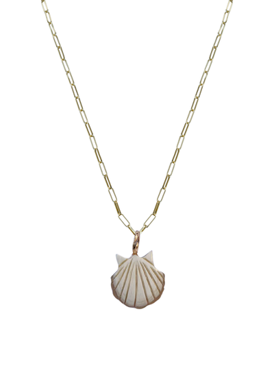 Necklace with a hand carved sea shell pendant on a white background