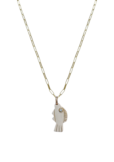 Gold chain necklace with a fish pendant on a white background