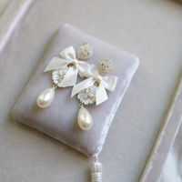 embellished mother of pearl + ivory bow