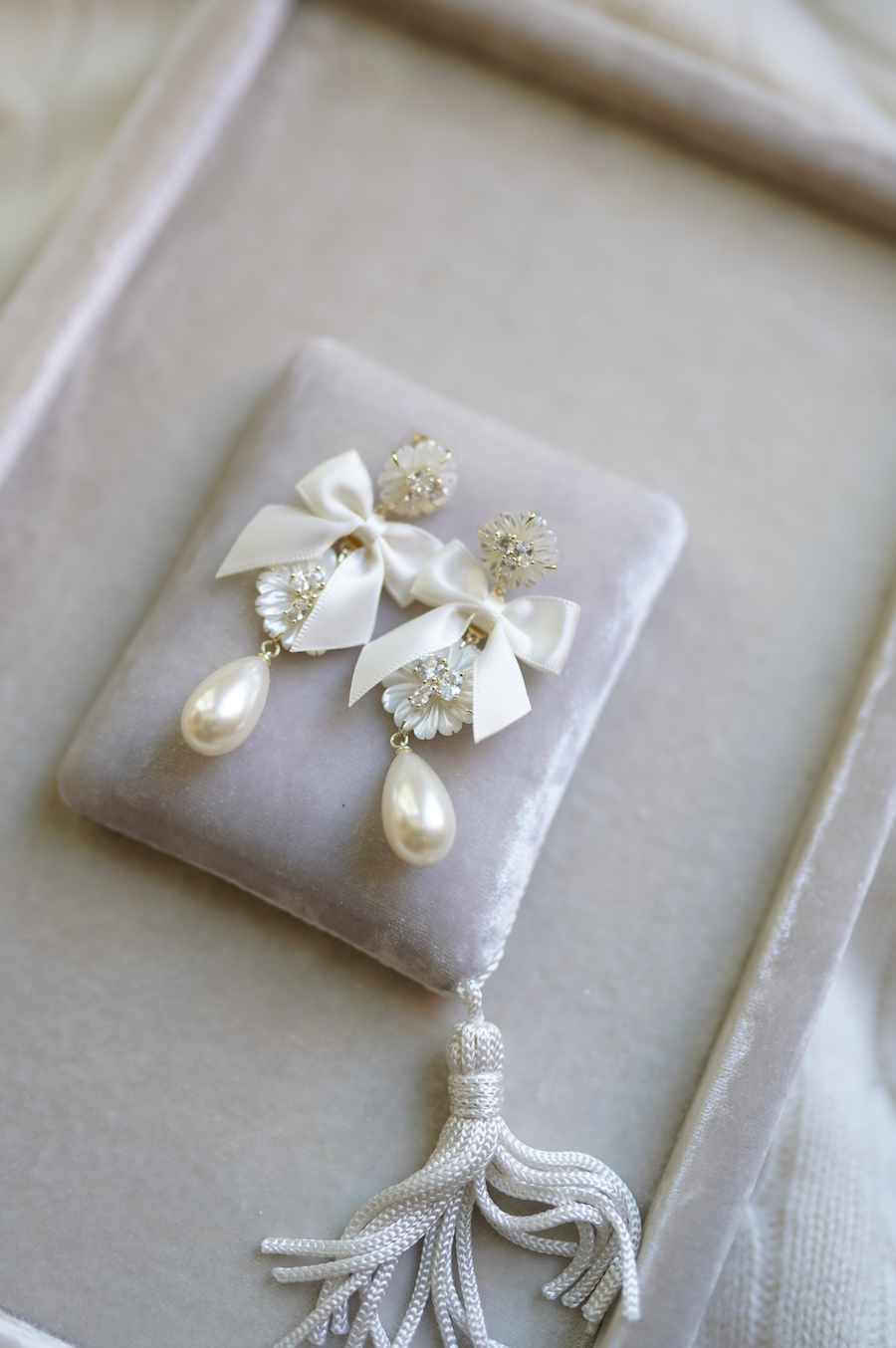 embellished mother of pearl + ivory bow