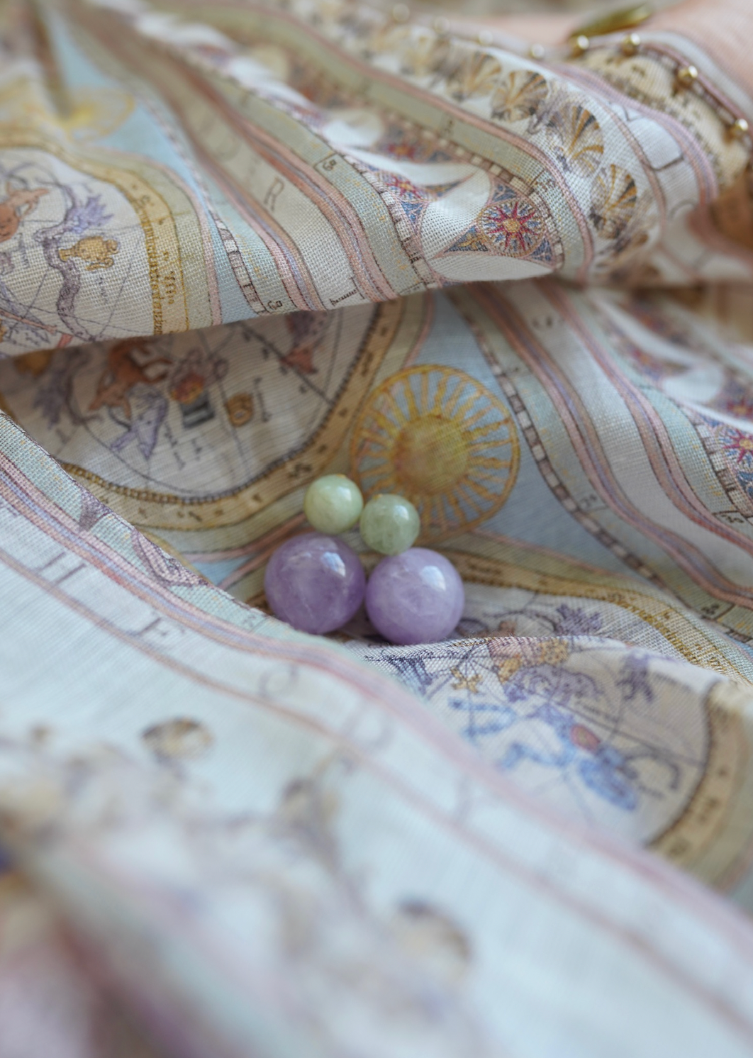 Antigua Gemstone Bubble Earrings in green and lavender on fabric