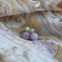 Antigua Gemstone Bubble Earrings in green and lavender on fabric