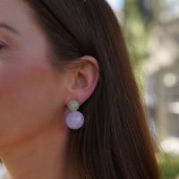 Antigua Gemstone Bubble Earrings in green and lavender purple on a model outside