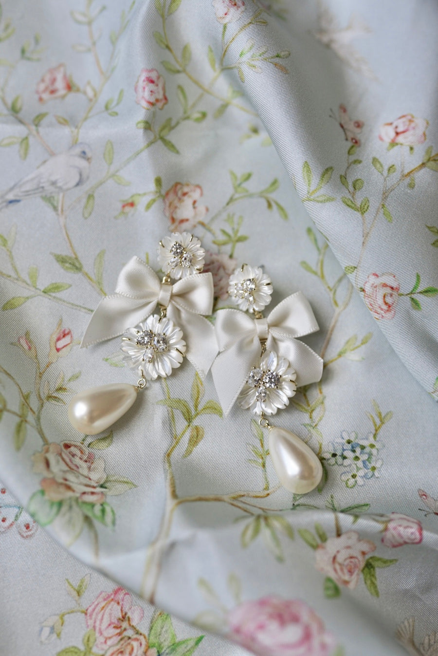 embellished mother of pearl + ivory bow